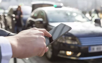Man orders a taxi from his mobile phone. Close-up hands